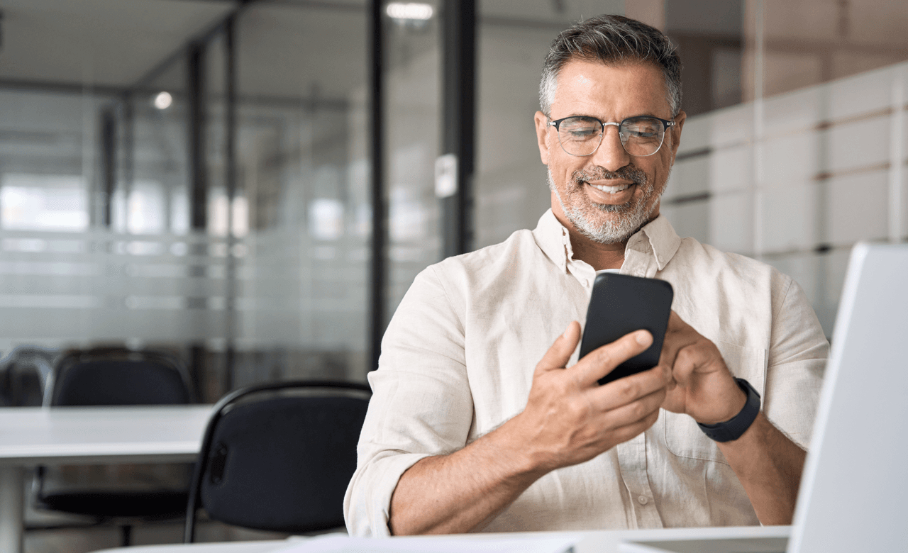 man paying with ach payment on phone