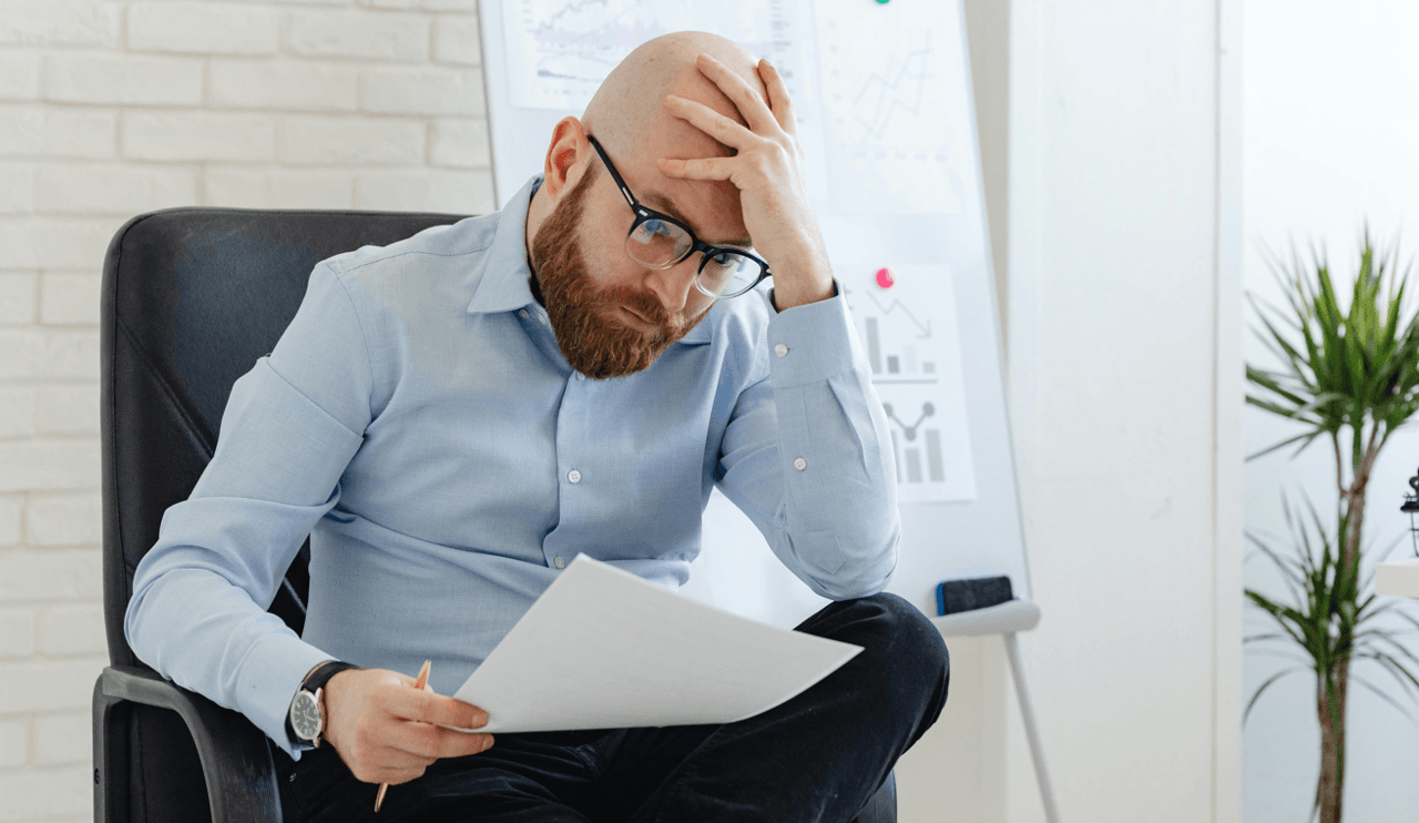 frustrated man evaluating current legal software
