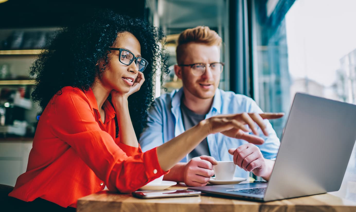 couple looking at website on laptop